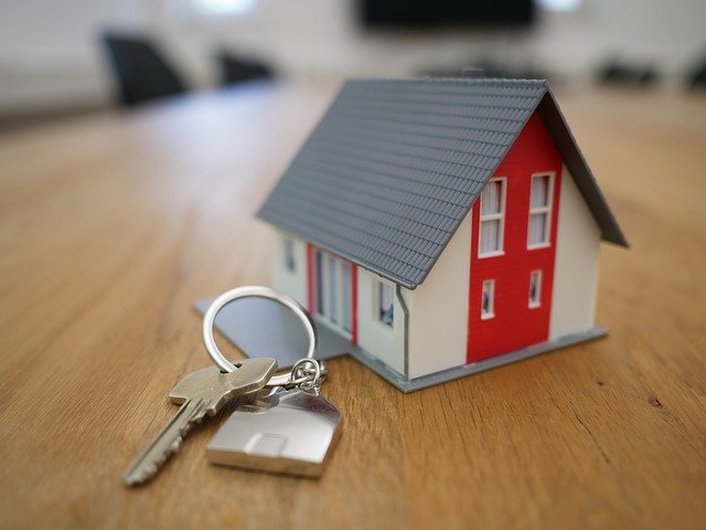photo of a toy house and keys - lawyers for real estate